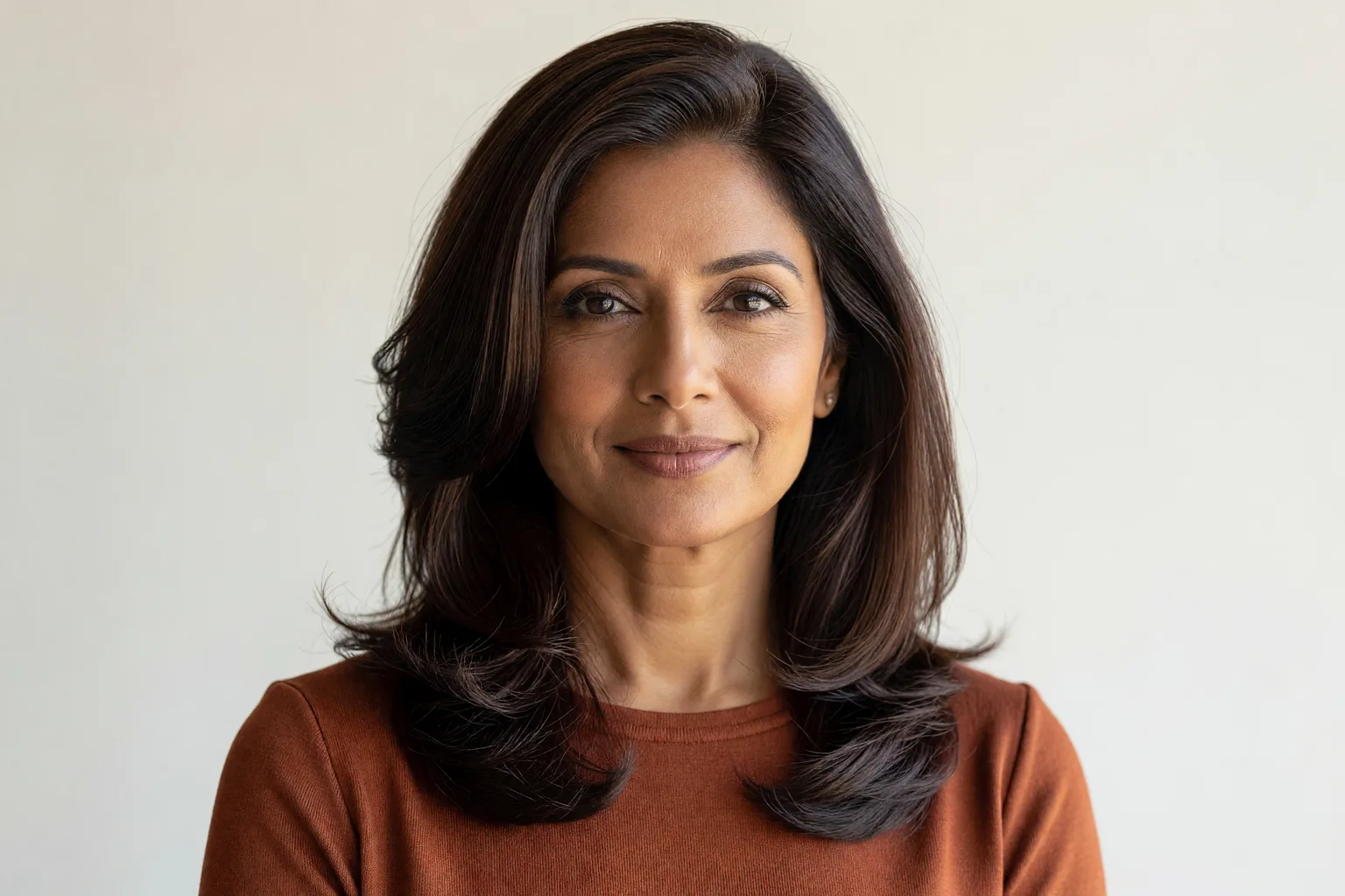 Generated portrait of a woman with thick dark brown hair in a shoulder-length lob with soft layers